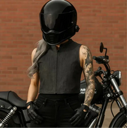 Women’s denim vest layered over hoodie – timeless fashion look”